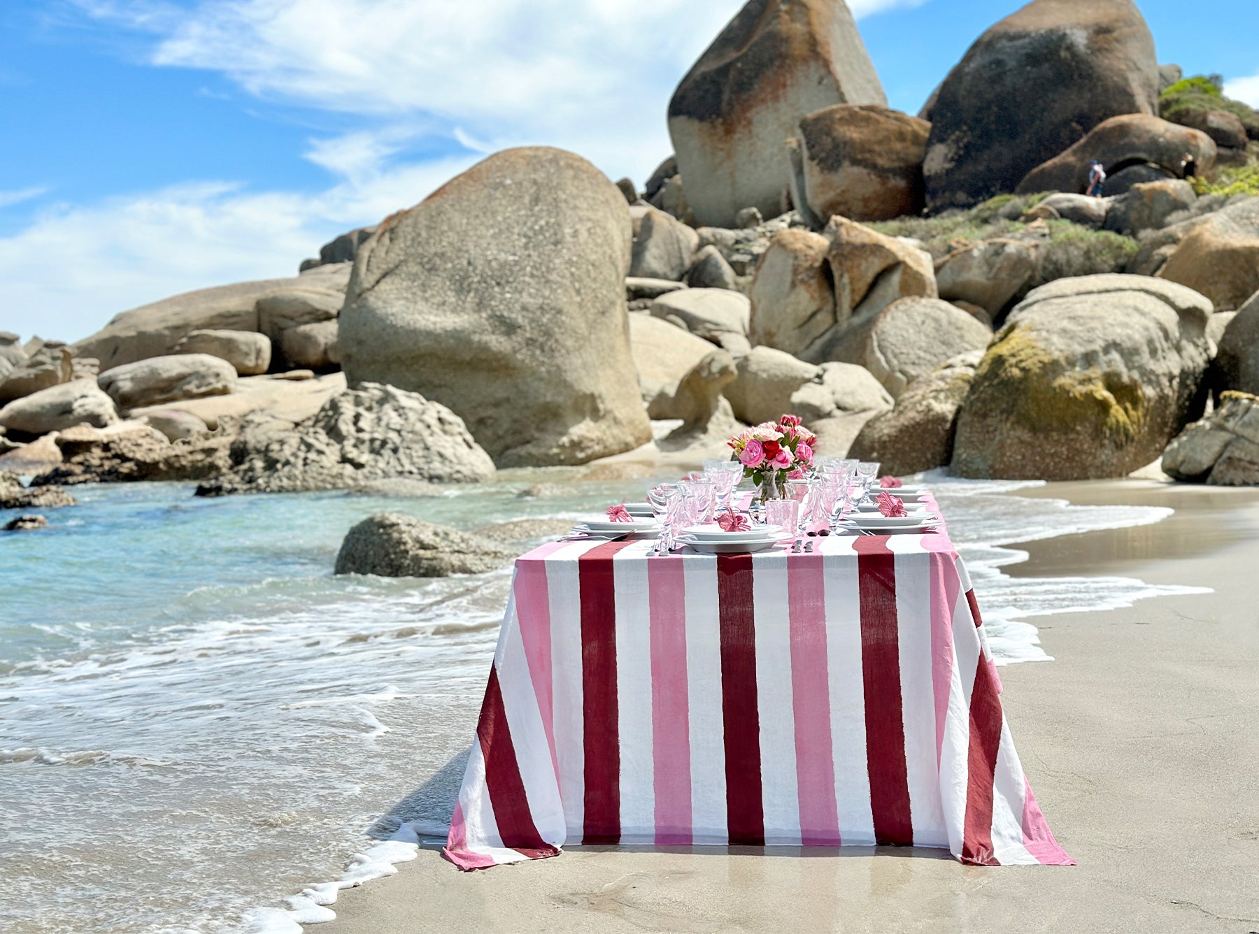 Red & Pink Stripe Linen tablecloth on the beach